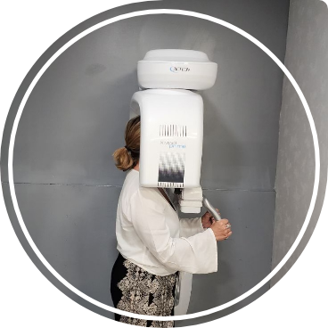 Dental patient receiving a C T cone beam scan of their mouth and jaw