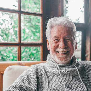 Closeup of senior man smiling at home