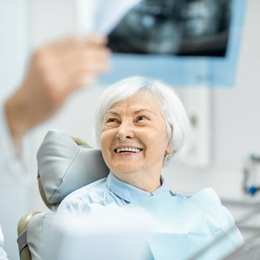 Dentist showing a patient her dental X-rays
