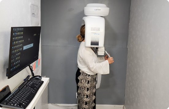 Dental patient getting a cone beam C T scan of their mouth and jaw