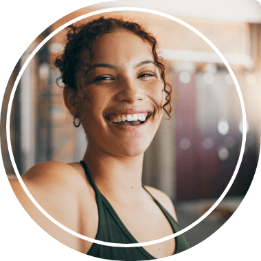 Smiling young woman in sleeveless blouse